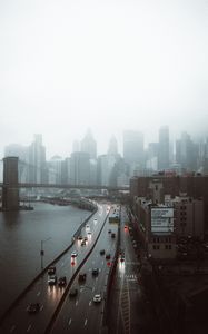 Preview wallpaper road, buildings, aerial view, city, fog