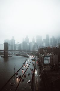 Preview wallpaper road, buildings, aerial view, city, fog
