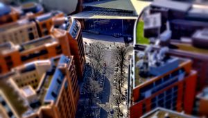 Preview wallpaper road, buildings, cars, street, height, aerial view