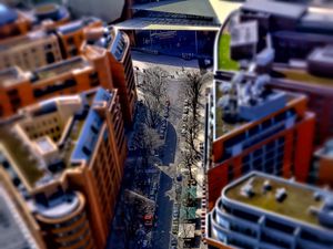 Preview wallpaper road, buildings, cars, street, height, aerial view