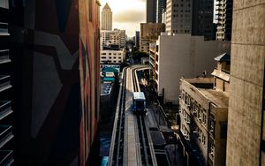 Preview wallpaper road, buildings, facades, car, palm trees