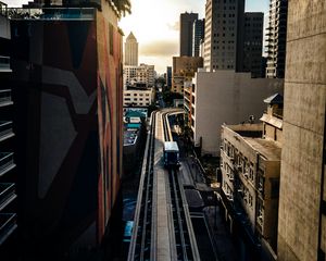 Preview wallpaper road, buildings, facades, car, palm trees