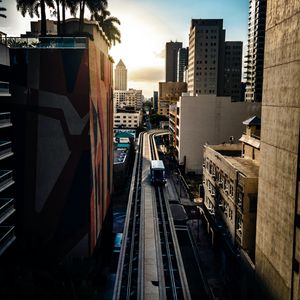 Preview wallpaper road, buildings, facades, car, palm trees