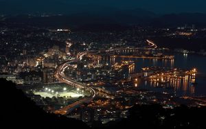 Preview wallpaper road, buildings, lights, night, glow, city