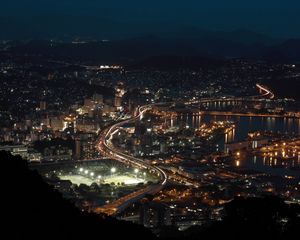 Preview wallpaper road, buildings, lights, night, glow, city