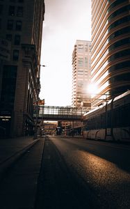 Preview wallpaper road, buildings, train, city, rays