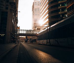 Preview wallpaper road, buildings, train, city, rays