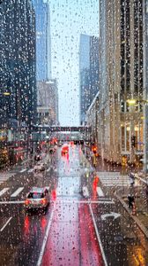 Preview wallpaper road, buildings, window, drops, rain, city