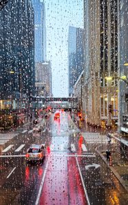 Preview wallpaper road, buildings, window, drops, rain, city