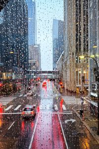 Preview wallpaper road, buildings, window, drops, rain, city