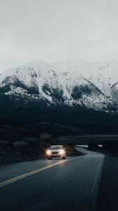 Preview wallpaper road, car, mountain, snowy, nature