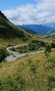 Preview wallpaper road, car, mountains, hills, grass, trees, nature