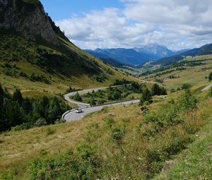 Preview wallpaper road, car, mountains, hills, grass, trees, nature