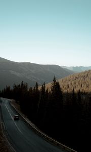 Preview wallpaper road, car, mountains, forest, movement