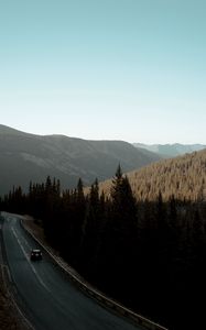 Preview wallpaper road, car, mountains, forest, movement