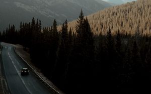 Preview wallpaper road, car, mountains, forest, movement