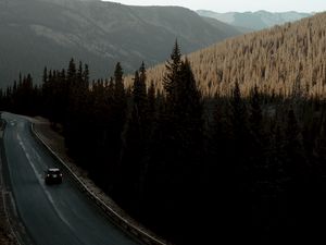 Preview wallpaper road, car, mountains, forest, movement