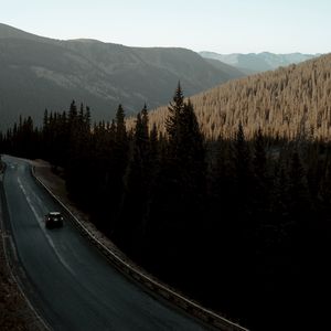 Preview wallpaper road, car, mountains, forest, movement