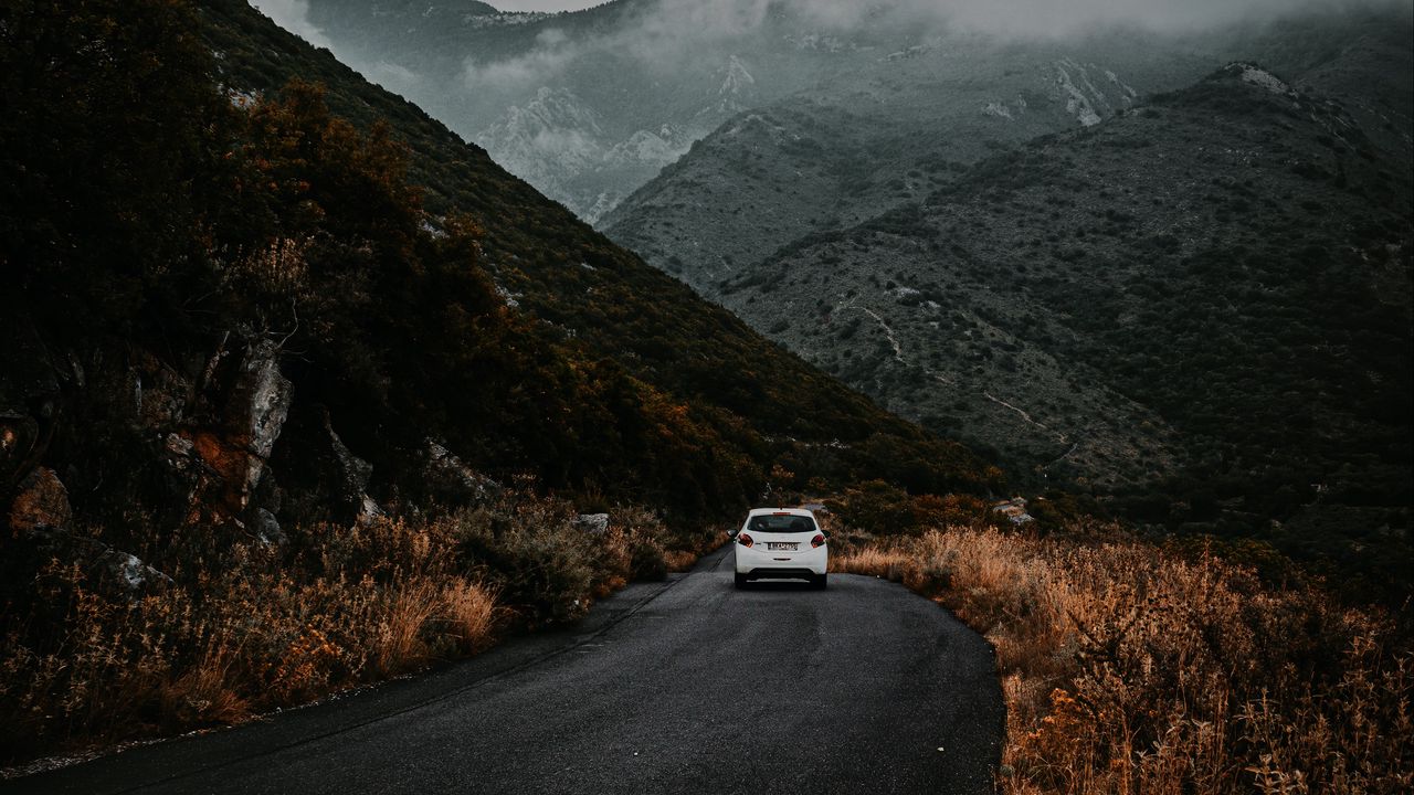 Wallpaper road, car, mountains, fog, clouds