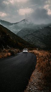 Preview wallpaper road, car, mountains, fog, clouds