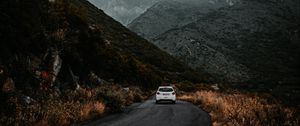 Preview wallpaper road, car, mountains, fog, clouds