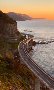 Preview wallpaper road, cars, bends, sea, aerial view