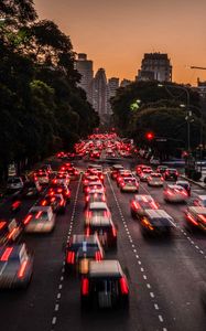 Preview wallpaper road, cars, buildings, city, evening