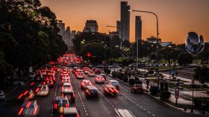 Preview wallpaper road, cars, buildings, city, evening