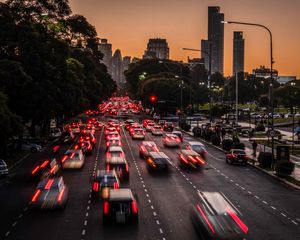 Preview wallpaper road, cars, buildings, city, evening