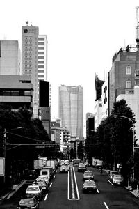 Preview wallpaper road, cars, buildings, city, bw