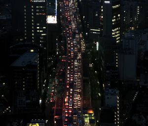 Preview wallpaper road, cars, buildings, street, city, aerial view, dark