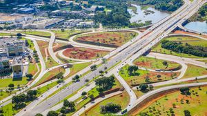 Preview wallpaper road, cars, buildings, trees, aerial view