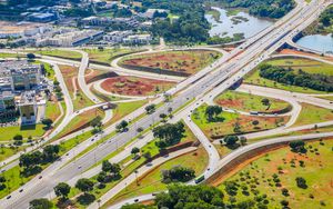 Preview wallpaper road, cars, buildings, trees, aerial view