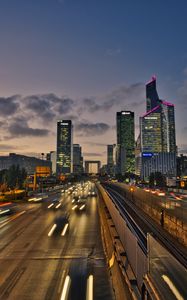 Preview wallpaper road, cars, buildings, evening, lights
