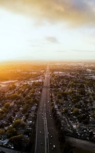 Preview wallpaper road, cars, houses, trees, aerial view