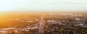 Preview wallpaper road, cars, houses, trees, aerial view