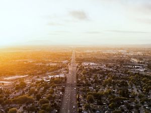 Preview wallpaper road, cars, houses, trees, aerial view