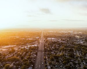 Preview wallpaper road, cars, houses, trees, aerial view