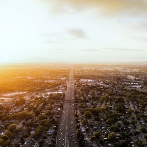 Preview wallpaper road, cars, houses, trees, aerial view