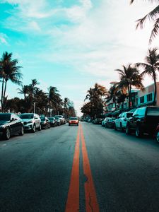 Preview wallpaper road, cars, markings, palm trees, sky