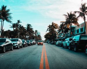 Preview wallpaper road, cars, markings, palm trees, sky