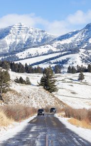 Preview wallpaper road, cars, snow, hills, mountains