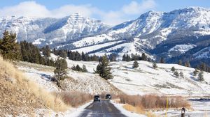 Preview wallpaper road, cars, snow, hills, mountains
