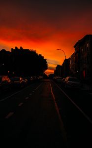 Preview wallpaper road, cars, street, sunset, distance