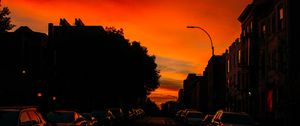 Preview wallpaper road, cars, street, sunset, distance