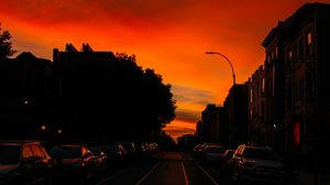 Preview wallpaper road, cars, street, sunset, distance