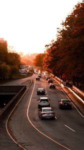 Preview wallpaper road, cars, traffic, sunset