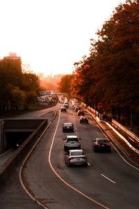 Preview wallpaper road, cars, traffic, sunset