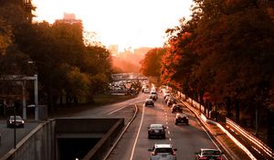 Preview wallpaper road, cars, traffic, sunset