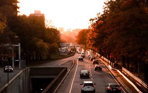 Preview wallpaper road, cars, traffic, sunset
